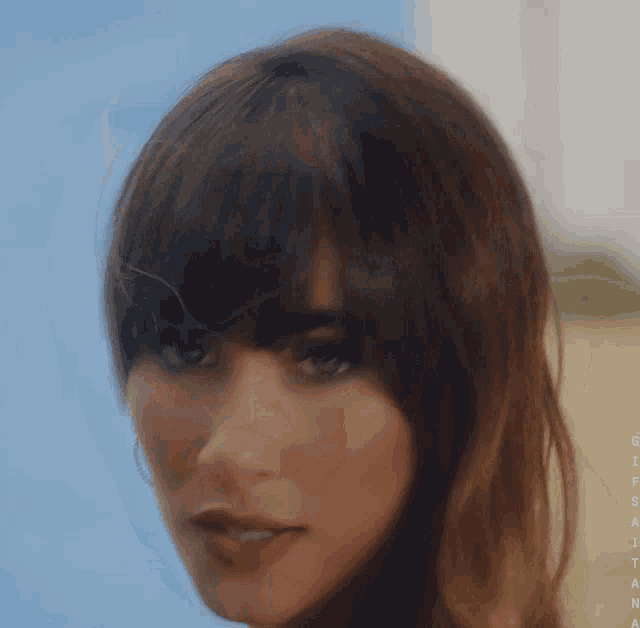 a close up of a woman 's face with the word gitana visible