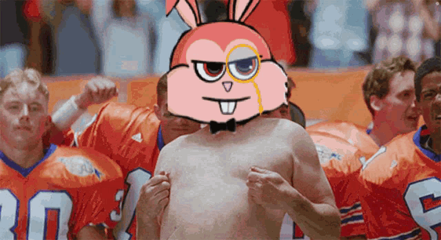 a shirtless man wearing a bunny mask is surrounded by a group of football players
