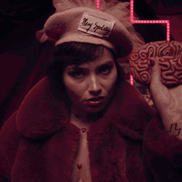 a woman wearing a pink hat that says mary eppolek
