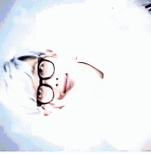a close up of a person 's face with their eyes closed and mouth open .