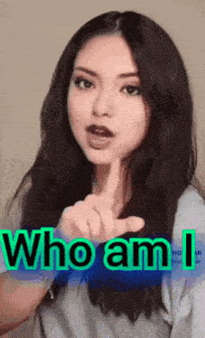 a woman is pointing at the camera with the words who am i above her