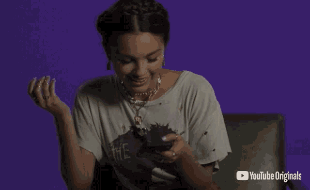 a woman wearing a t-shirt that says the cure laughs