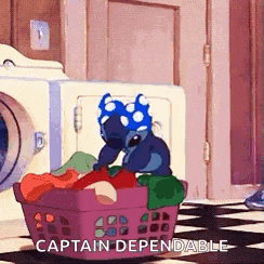stitch from lilo and stitch is sitting in a laundry basket .