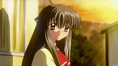 a close up of a girl with long hair and a red bow