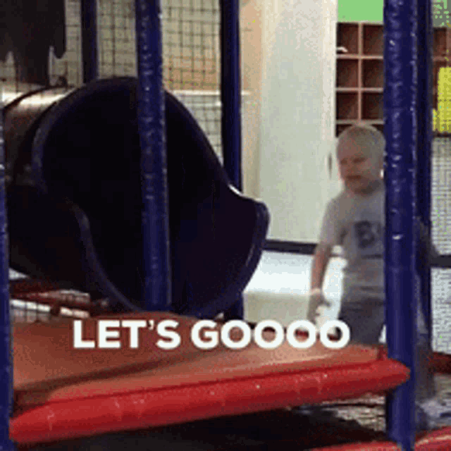 a child is playing in a playground with the words let 's goooo
