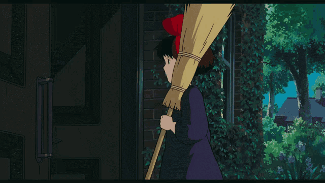 a girl with a red bow on her head carrying a broom