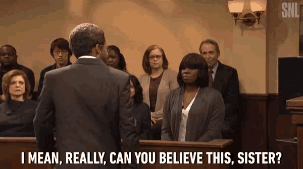 a man in a suit stands in front of a judge and says " i mean really can you believe this sister "