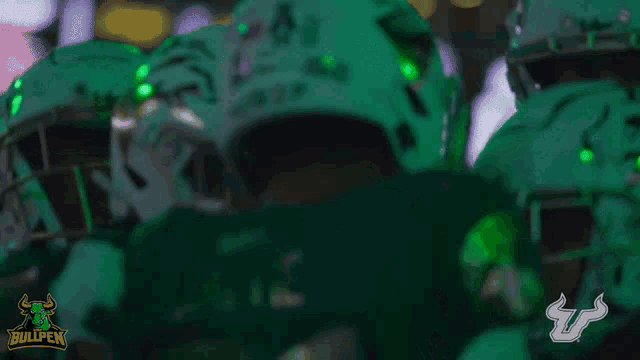 a group of football players wearing green uniforms with the word bullpen on the bottom