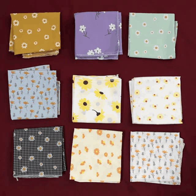 a bunch of fabrics with flowers on them