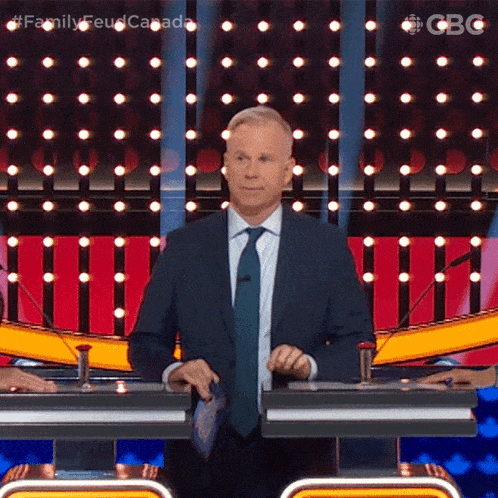 Tapping Table Gerry Dee GIF - Tapping Table Gerry Dee Family Feud Canada GIFs