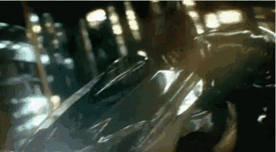 a close up of a person standing next to a car .