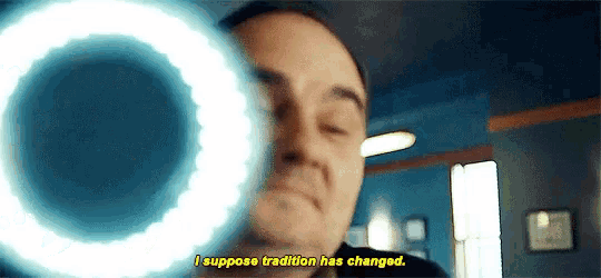 a close up of a man 's face with the words i suppose tradition has changed