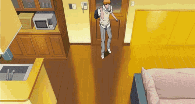 a man with a backpack stands in a living room