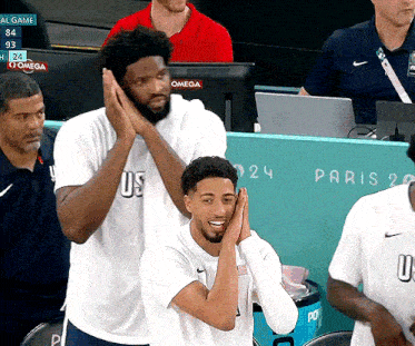 a basketball player wearing a white shirt that says us on it