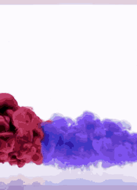 a red and purple smoke coming out of a bottle on a white background .