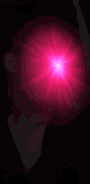 a close up of a person 's eye with a red light coming out of it