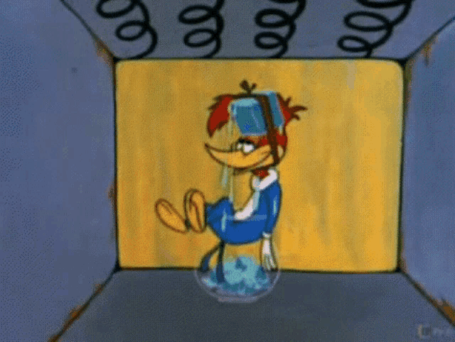 a woody woodpecker cartoon character is sitting in a box with a spiral hanging from the ceiling .