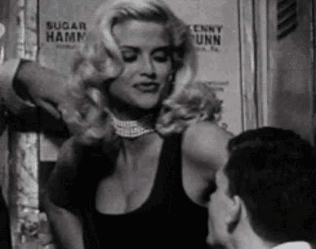 a woman stands in front of a sign that says sugar hamm