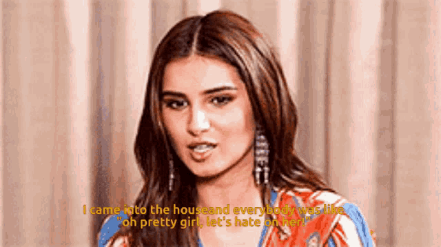 a woman is talking and says i came into the house and everybody was like oh pretty girl let 's hate on her