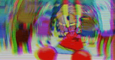 a blurry picture of a person 's face with a rainbow of colors .