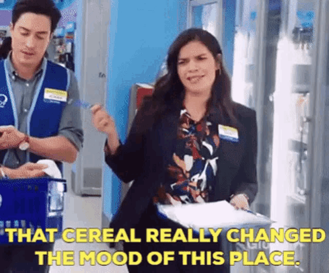 a woman is standing in a store with a clipboard and a man is standing next to her .