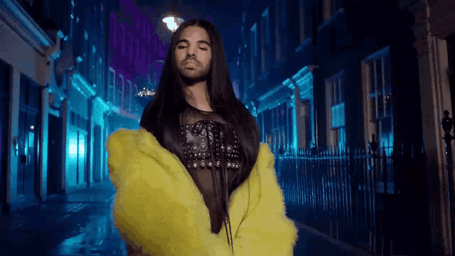 a man with a beard wearing a yellow fur coat