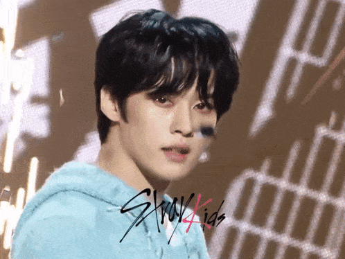 a close up of a person 's face with stray kids written on it