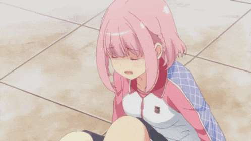 a girl with pink hair is sitting on a tiled floor