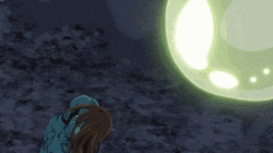 a person looking at a glowing ball in the sky