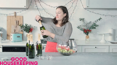 Opening Champagne Becca Miller GIF - Opening Champagne Becca Miller Shocked GIFs
