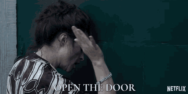a netflix ad shows a woman in handcuffs and the words open the door
