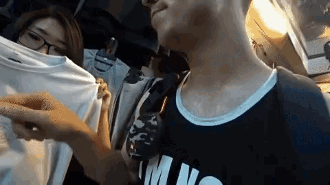 a man wearing a shirt that says ' m n ' on it