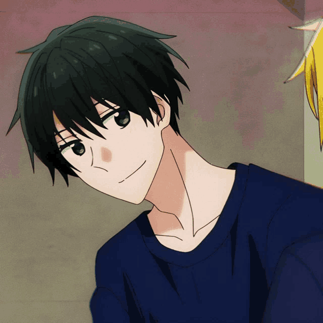 a boy with black hair and a blue shirt looks at the camera
