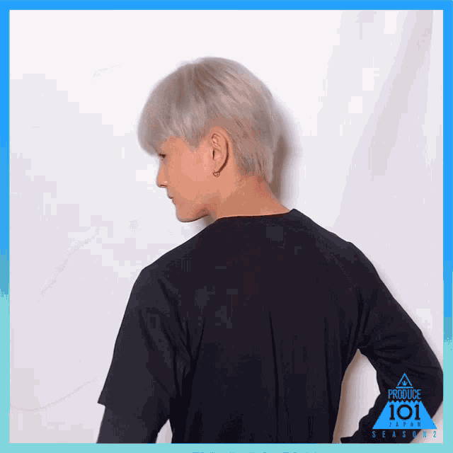 a man is wearing a black shirt that says produce 101 season 3