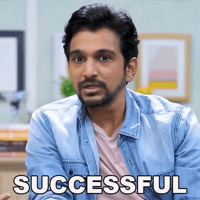 a man in a denim jacket says successful in front of his face