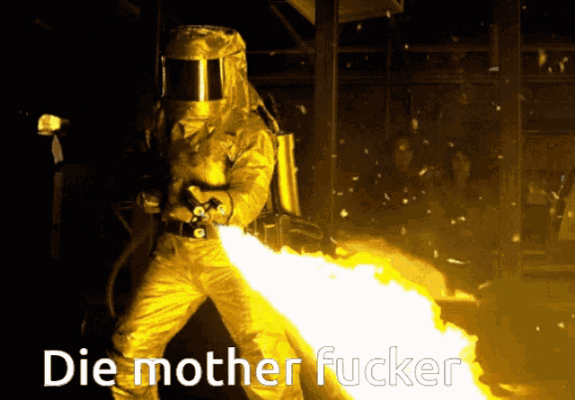 a man in a protective suit is holding a flamethrower with the words die mother fucker written below him