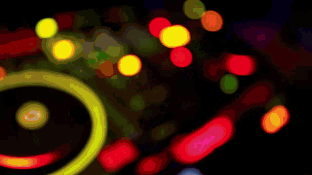 a colorful background with a yellow circle in the middle of it