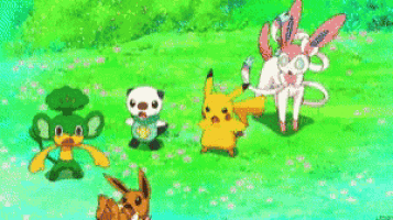 a group of pokemon are playing with a hula hoop in a grassy field .
