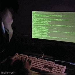 a person is typing on a keyboard in front of a computer monitor with a green screen