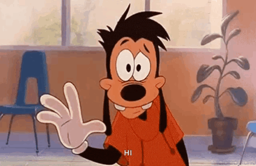 a goofy cartoon character is waving his hand in a classroom .