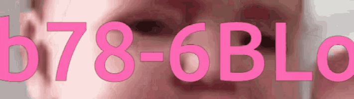 a close up of a person 's face with the numbers 678-6blc visible