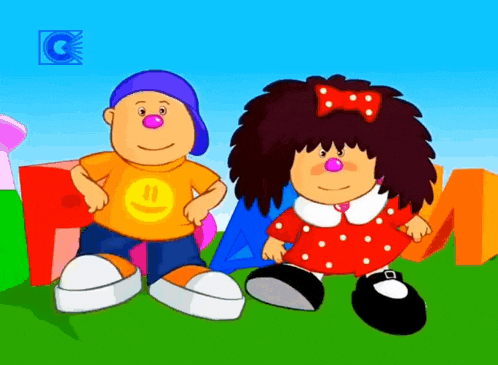 a boy with a smiley face on his shirt and a girl with a bow in her hair