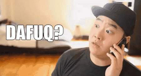 a man wearing a hat is talking on a cell phone and the word dafuq is visible in the background .