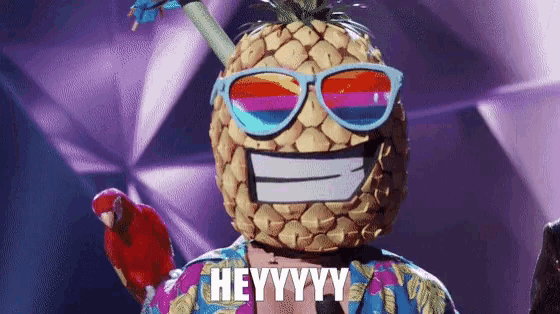 a person wearing a pineapple mask with sunglasses and a parrot