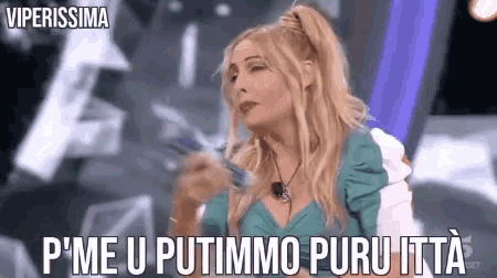 a woman with blonde hair is holding a pen and says " p'me u putimmo puruitta "