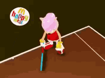a sonic the hedgehog doll is holding a tennis racquet