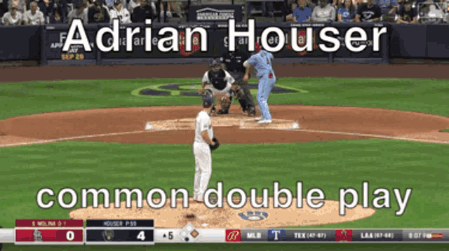 a baseball game is being played and adrian houser is pitching the ball