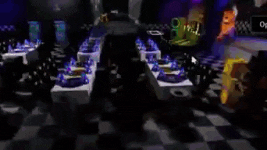 a blurry picture of a party room with tables and chairs and party hats on them .