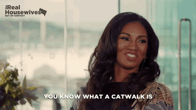 a woman says " you know what a catwalk is " in front of a sign that says real housewives
