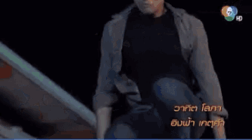 a man on a motorcycle is jumping over another man